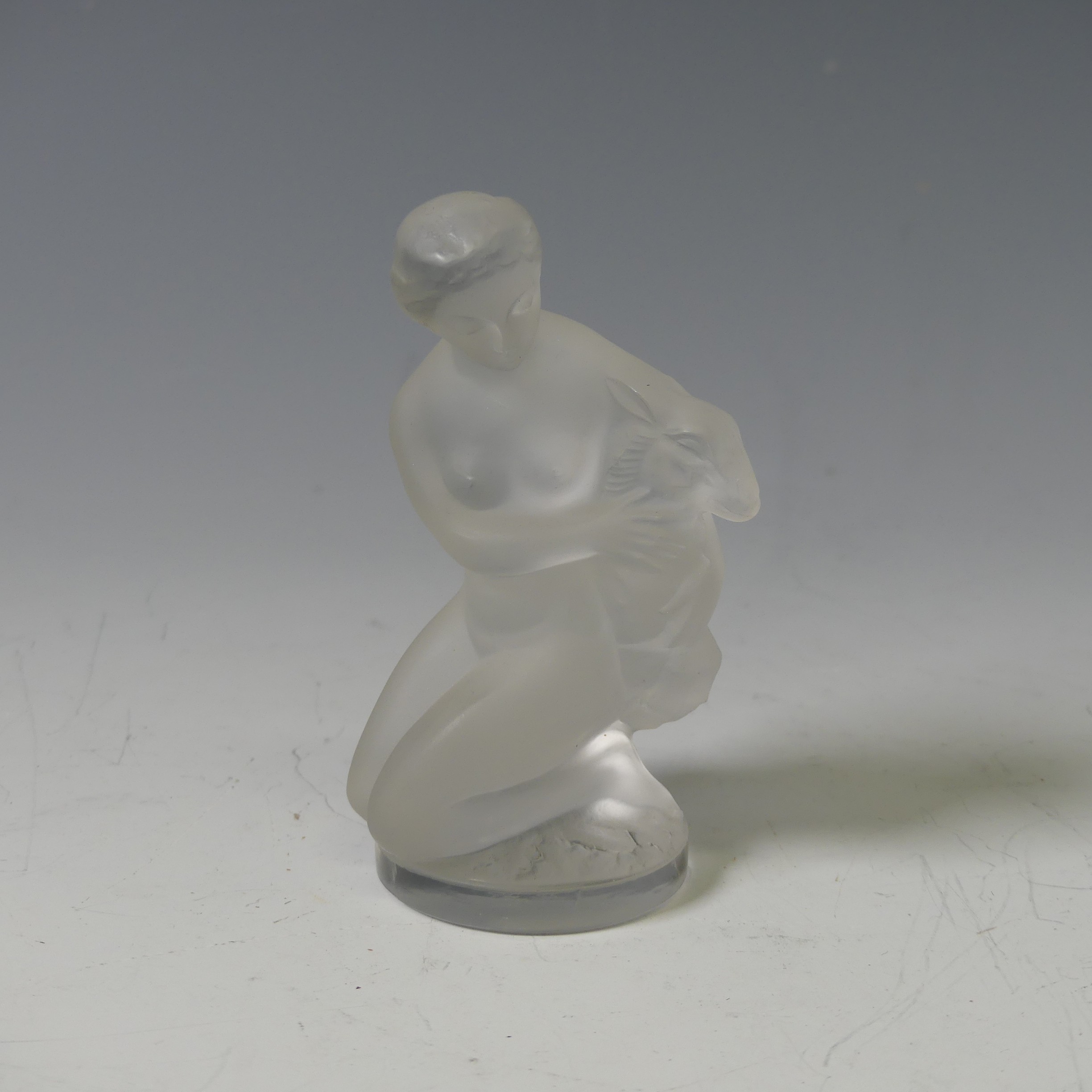 A Lalique frosted glass figure of a Nude with Goat, with stamped mark to base, H 12cm, together with