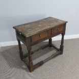 An 18thC oak side table with two frieze drawers, missing one side panel, lots of wear and tear due