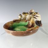 A Grace Seccombe studio pottery Trinket Dish, modelled with nine kookaburras perched along the edge,