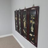 A set of four oriental hardwood Chinese inspired Hanging Screens, inlaid with carved stone