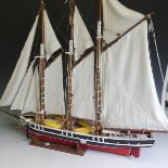 A vintage wooden model three-mast Schooner sailing ship, complete with sails, jibboom, 4 life boats,