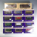 Dapol: Fifty-eight ‘00’ gauge freight wagons and vans, all boxed and in good condition (58)