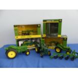 Four boxed John Deere 1:16 scale models by Speccast and ERTL, including a Model 44 plow, model 55ABH