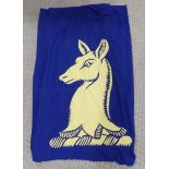 Vintage textiles; a large blue ground flag, the centre appliqued with a yellow springbok image,