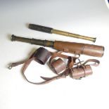 A British Army Issue three draw brass Telescope, complete with its brown leather covering and end