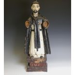 An antique carved wooden Guatemalan ecclesiastical Figure of a preaching 'Saint Raymond of