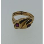 An antique 9ct rose gold double snakes head Ring, the heads each set ruby and with two sapphire