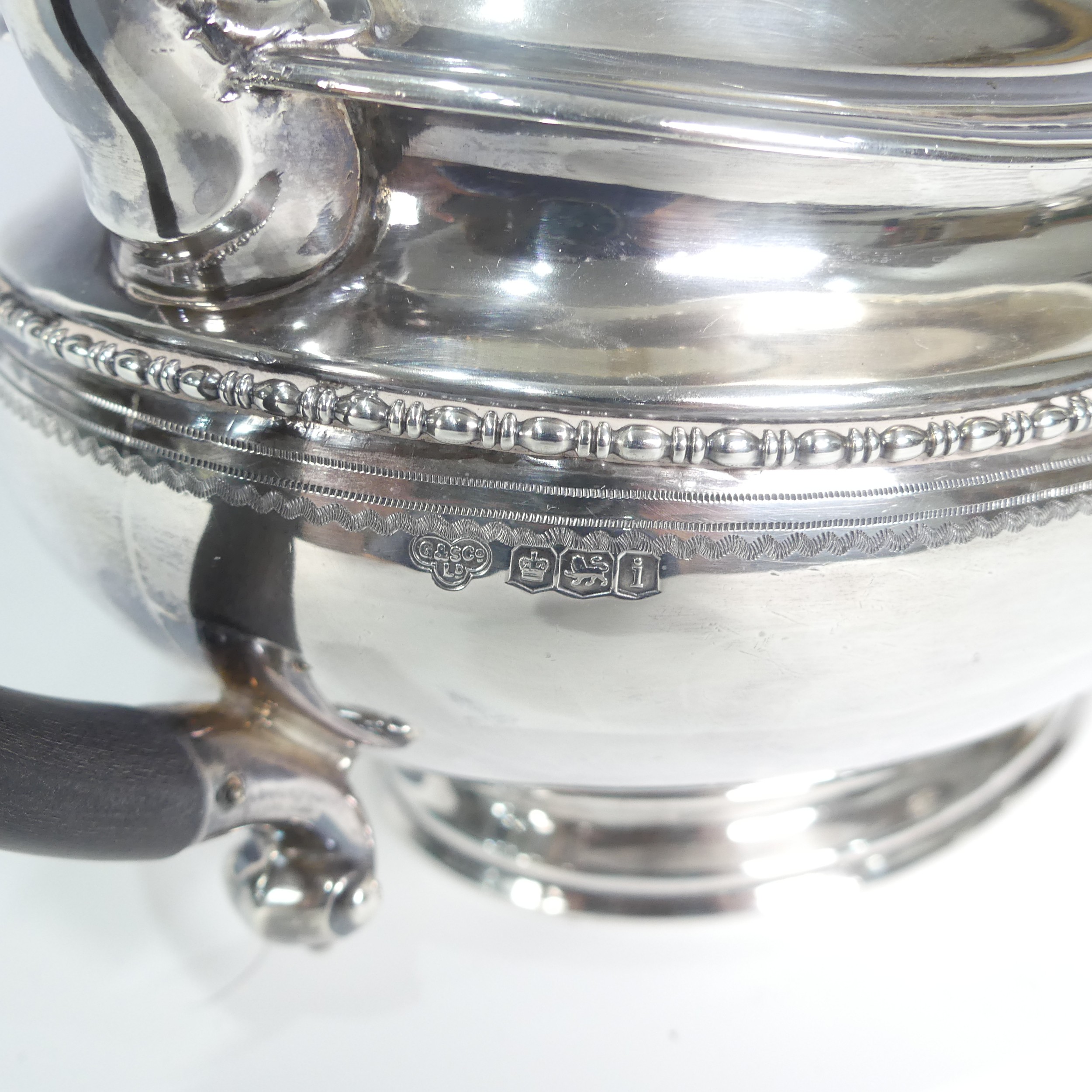 A George V silver three piece Tea Set, by Goldsmiths & Silversmiths Co Ltd., hallmarked Sheffield - Image 13 of 14