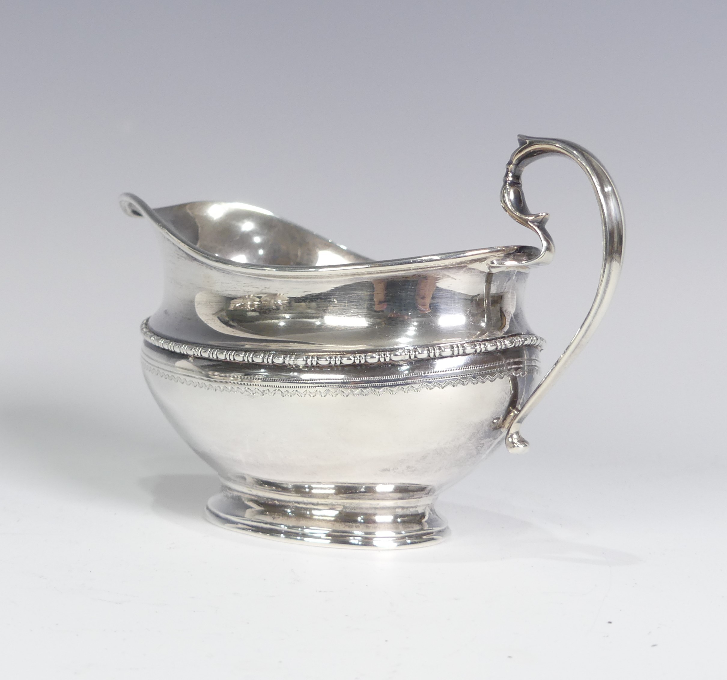 A George V silver three piece Tea Set, by Goldsmiths & Silversmiths Co Ltd., hallmarked Sheffield - Image 2 of 14