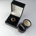 A 9ct yellow gold Ring, set with a circular facetted garnet, 10mm diameter, Size U, together with