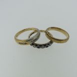 A 9ct yellow and white gold Ring, each side channel set with four small diamond points, Size O,
