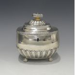 A George III silver Tea Caddy, by William Bennett, hallmarked London, 1812, of rounded rectangular