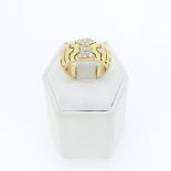 An 18ct gold and diamond Dress Ring, the centre pavé set with eleven small diamonds,Size L½, 9.8g.