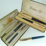 Parker: two cased Parker "51" fountain pen and propelling pencil sets, one rolled gold and black,