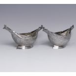 A pair of antique Indian silver boat-shaped Dishes, with bird head handles, pierced rims and