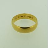 A 22ct gold Band, Size W, 7.1g.
