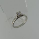 A single stone diamond Ring, the princess cut stone approx. 0.4ct, four claw set in platinum, Size