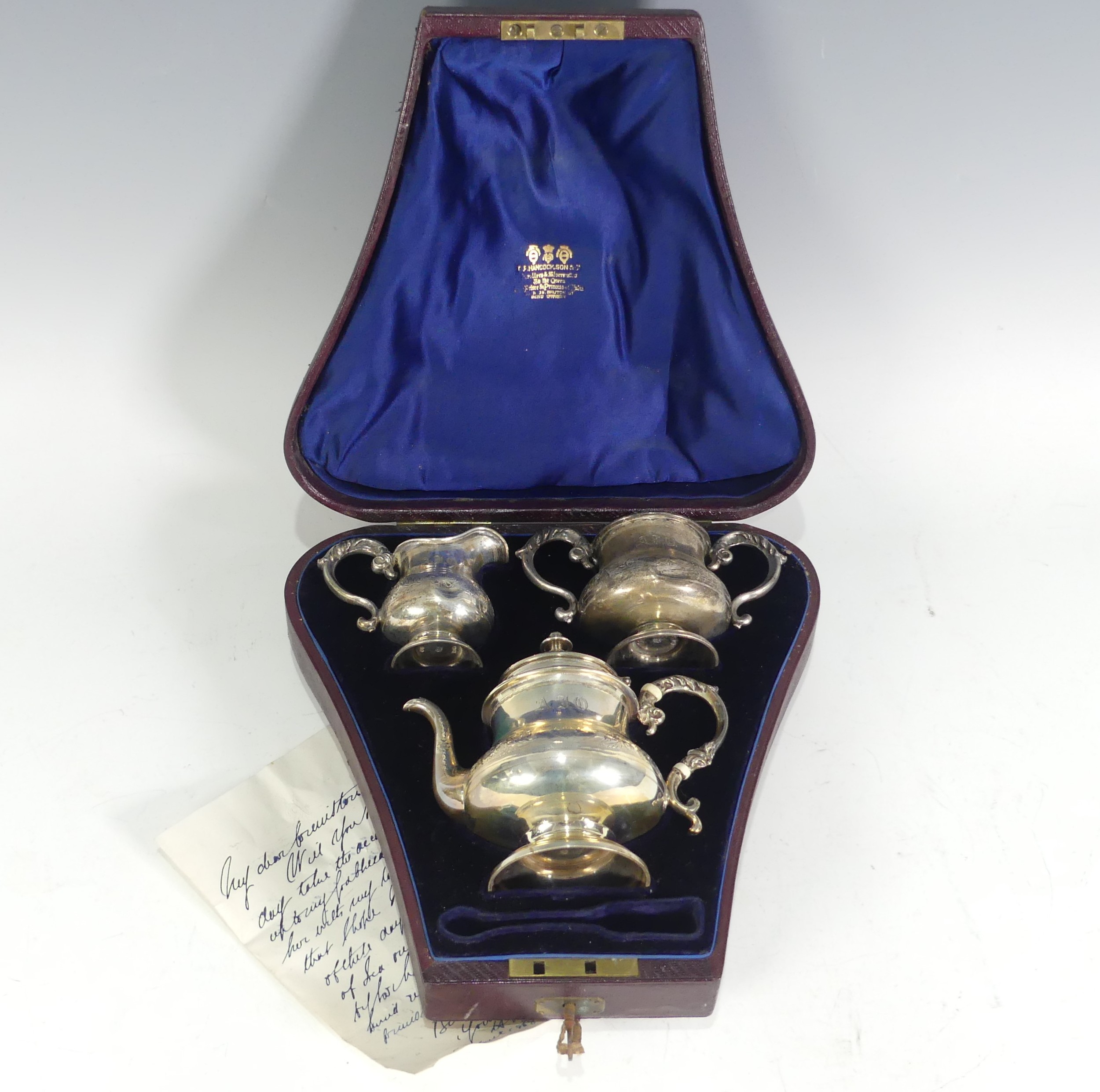 A cased Victorian silver three piece bachelor Tea Set, by Daniel & Charles Houle, hallmarked London, - Image 3 of 17