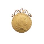 A George III gold Guinea, dated 1792, with soldered mount, total weight 9.1g.