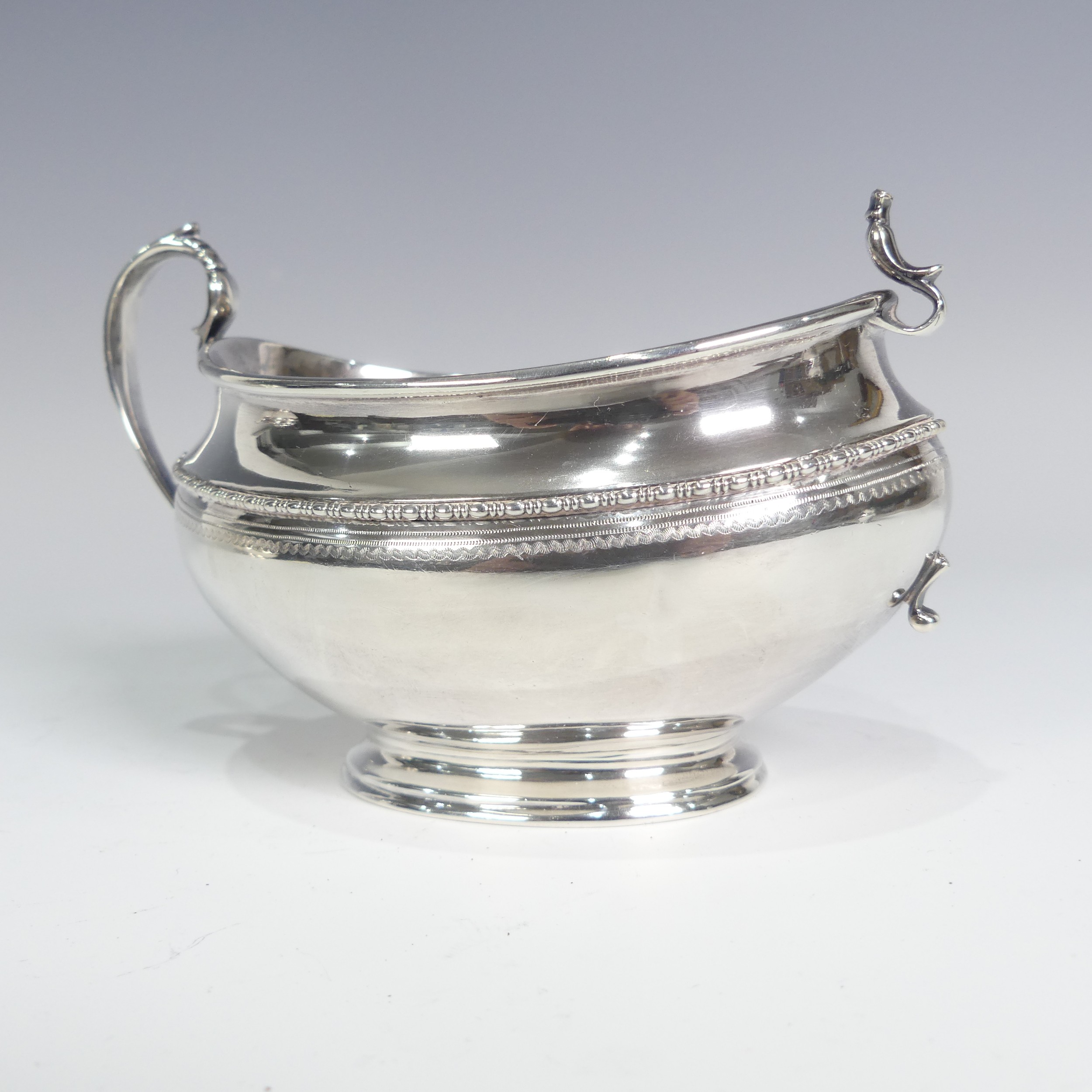 A George V silver three piece Tea Set, by Goldsmiths & Silversmiths Co Ltd., hallmarked Sheffield - Image 8 of 14