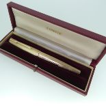A 9ct gold Parker Fountain Pen, with engine turned decoration and vacant cartouche, 13.5cm long,