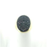 A 14ct gold and bloodstone Signet Ring, the oval matrix crested, the shank marked 585 and tested,