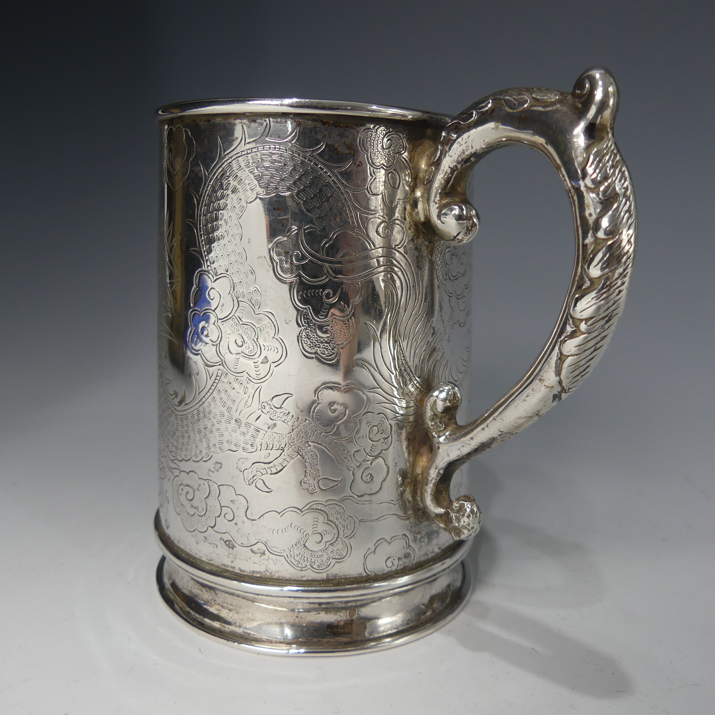 A 19thC Chinese export silver Mug, by Hung Chong, of conical form with engraved scrolling dragon