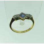 An Art Deco sapphire and diamond Ring, the central square sapphire, 4.7mm wide, with a diamond point