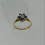 A small sapphire and diamond cluster Ring, all mounted in 18ct yellow gold, Size N½, 2.6g.