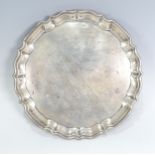 A George V silver Salver, by Barker Brothers, hallmarked Chester, 1916, of shaped circular form,