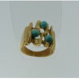 A 14ct yellow gold and turquoise Ring, the open textured 'bark' front set three circular