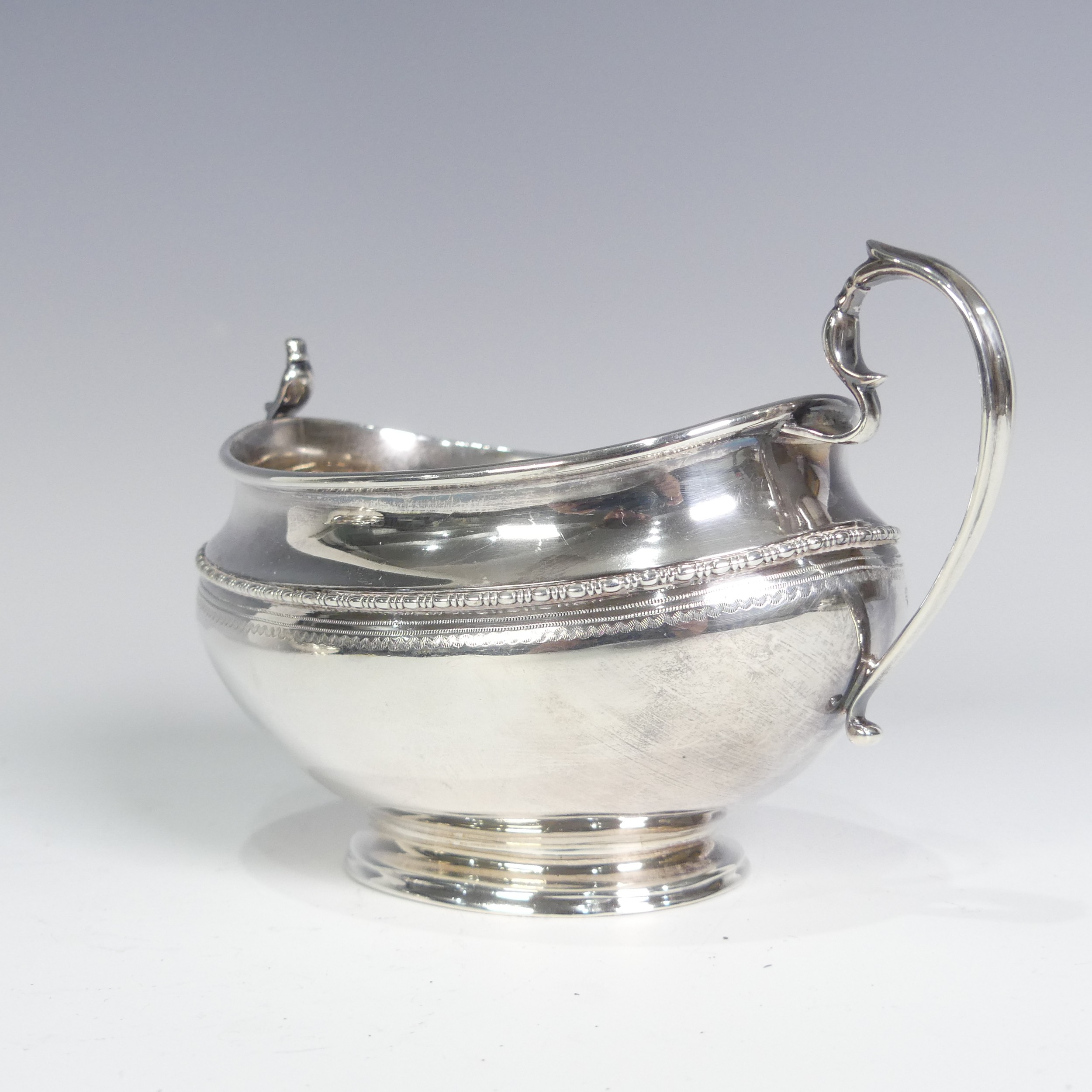 A George V silver three piece Tea Set, by Goldsmiths & Silversmiths Co Ltd., hallmarked Sheffield - Image 6 of 14