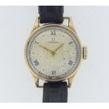 A vintage Omega 9ct gold lady's Wristwatch, the silvered dial with black Roman numerals and button