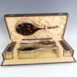 A George V silver and tortoiseshell mounted Dressing Table Set, by James Deakin & Sons, hallmarked