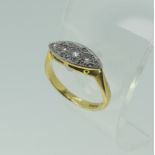 A small three stone diamond Ring, all mounted in a lozenge front with six further diamond points,