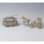 An early 20th century silver filigree miniature model of a Tram, with four wheels and pantograph,