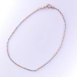 An 18ct gold Necklace, formed of three alternate white and yellow links, with clip fitting marked