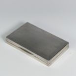 A George V silver Cigarette Box, by Wilmot Manufacturing Co., hallmarked Birmingham, 1925, of hinged