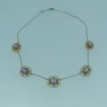 A Edwardian amethyst Necklace, the five oval facetted stones approx. 8.5mm long, millegrain set in