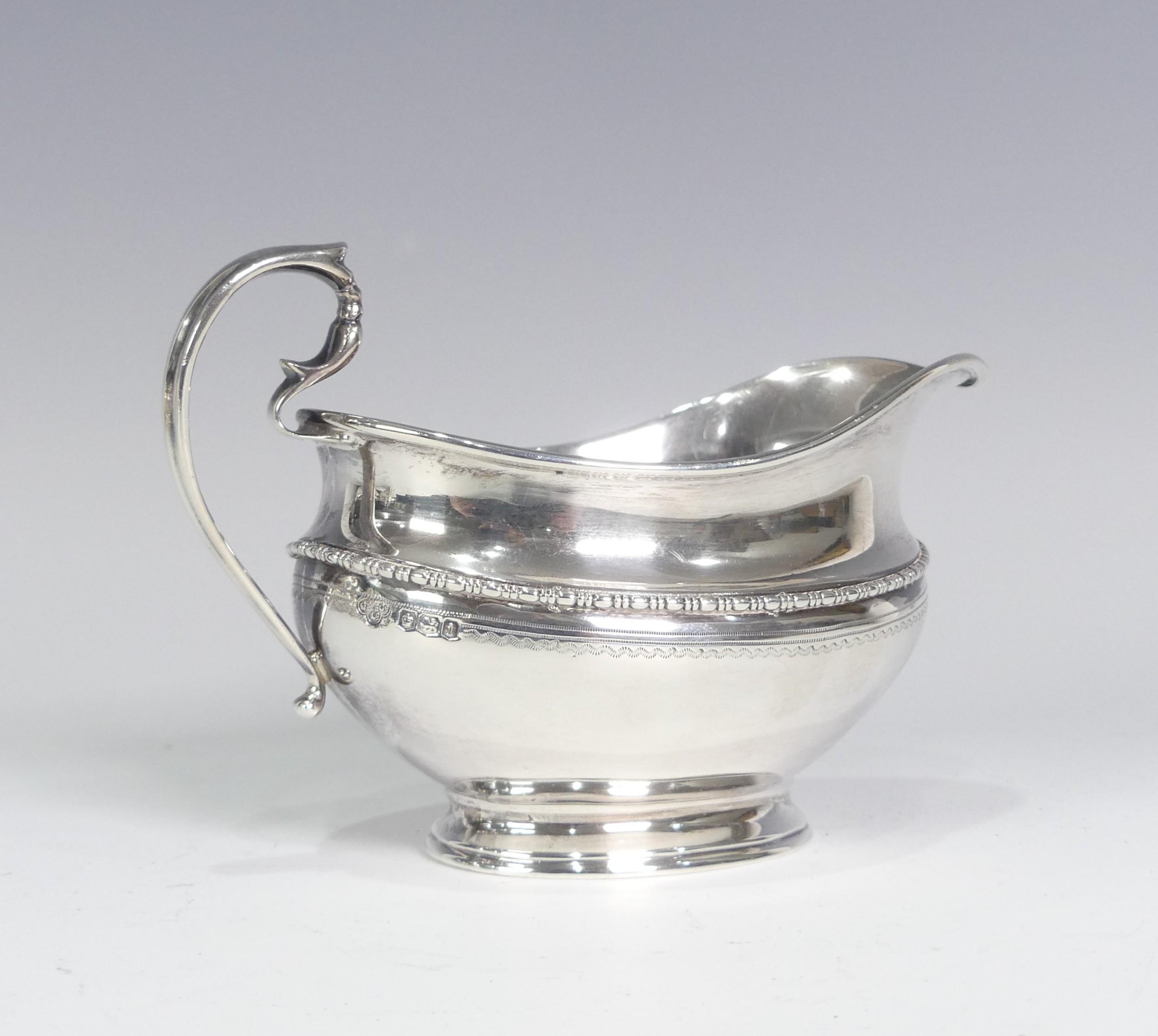 A George V silver three piece Tea Set, by Goldsmiths & Silversmiths Co Ltd., hallmarked Sheffield - Image 3 of 14