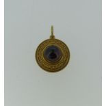 A 19thC cabochon garnet Pendant, of circular 'target' form, the central stone approx. 9.5mm