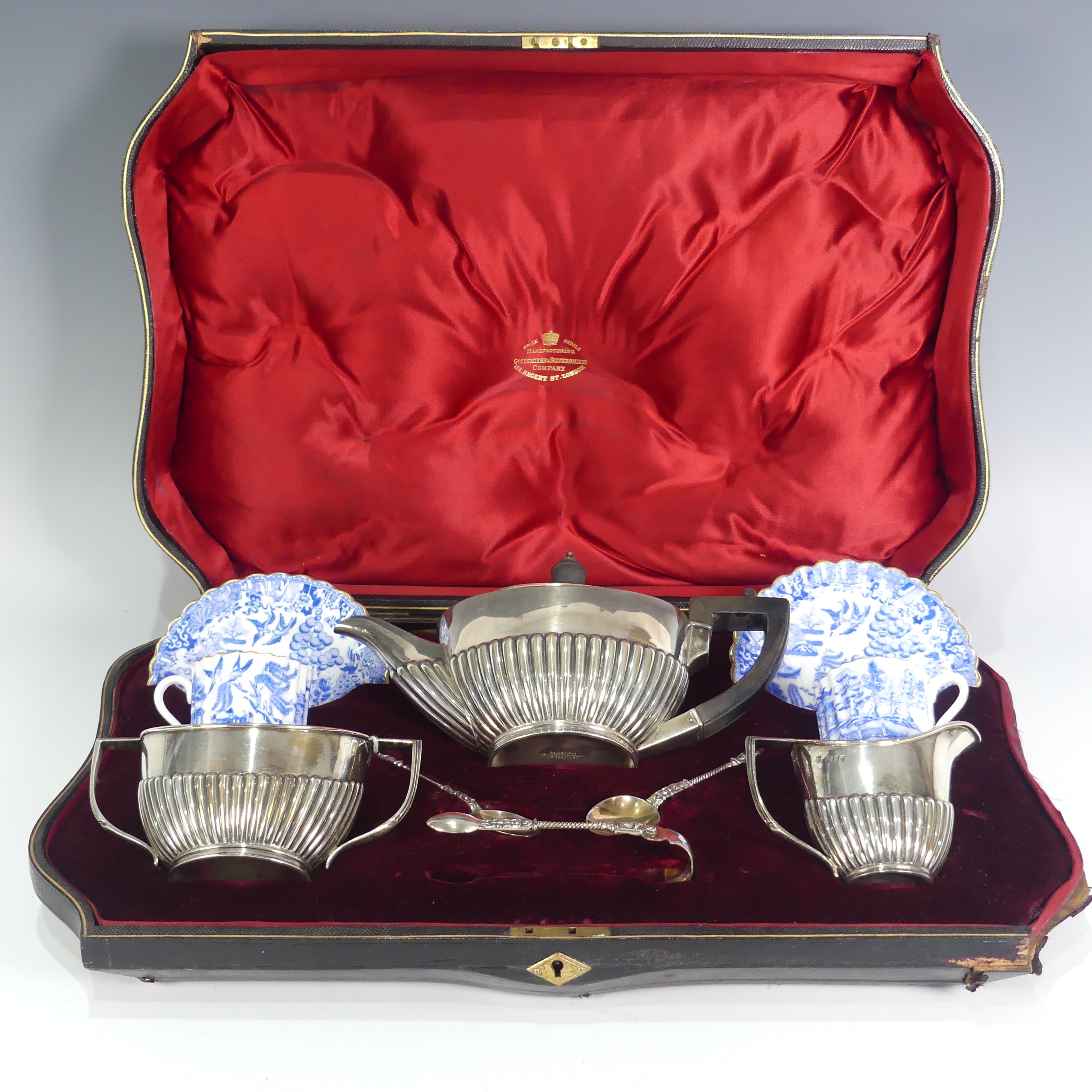 A cased Victorian silver three piece tete-a-tete Tea Set, by Goldsmiths & Silversmiths Co., - Image 2 of 5