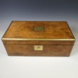 A large Victorian burr walnut Writing slope, brass bound with gilt brass escutcheons, lid opening to