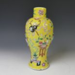 A late 19thC Chinese famille jaune baluster Vase, the yellow ground with enamel decorations in