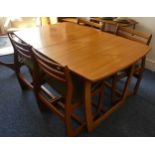 A mid 20thC retro teak extending Dining Table, of a rounded rectangular shape and butterfly style