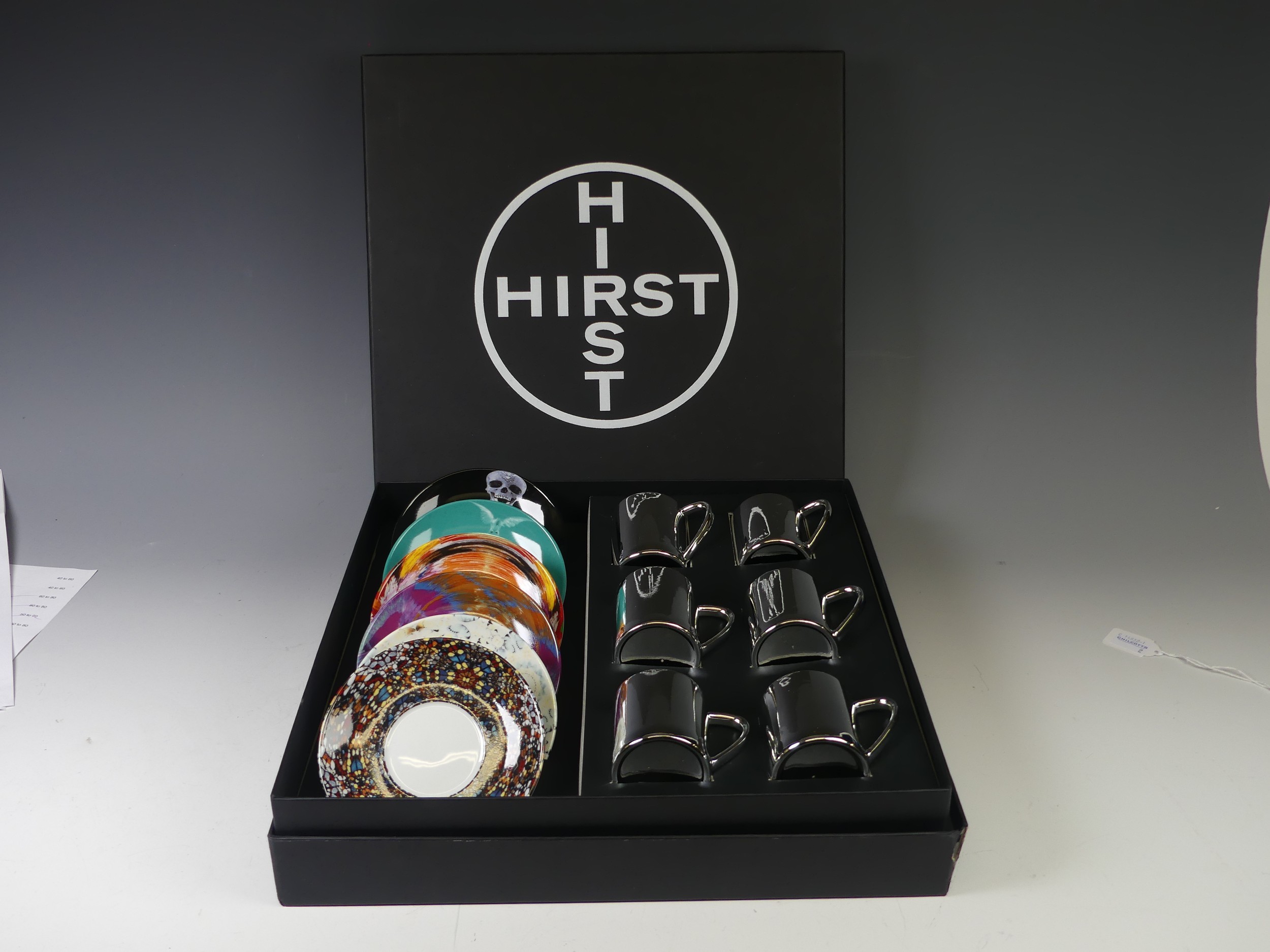 A Damien Hirst six piece anamorphic Coffee Set, comprising six silver Cups with six corresponding - Image 2 of 4