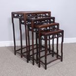 An early 20thC Chinese hardwood quartetto nest of Tables, panelled tops above carved and pierced