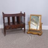 A Canterbury magazine rack, with single drawer, base raised on casters, together with a dressing