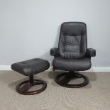 A Norwegian 'Hjellegjerde' brown leather reclining swivel chair in a stressless style, together with