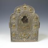 A Tibetan copper, silver and gilt Gau (or G'au), the portable shrine of traditional form, the